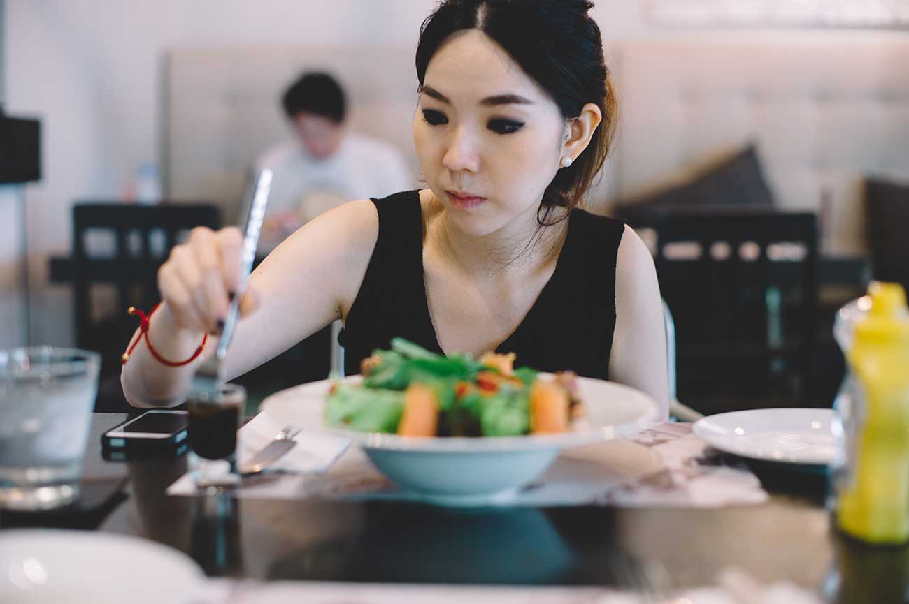 Asian Woman Eating a Healthy Lunch.