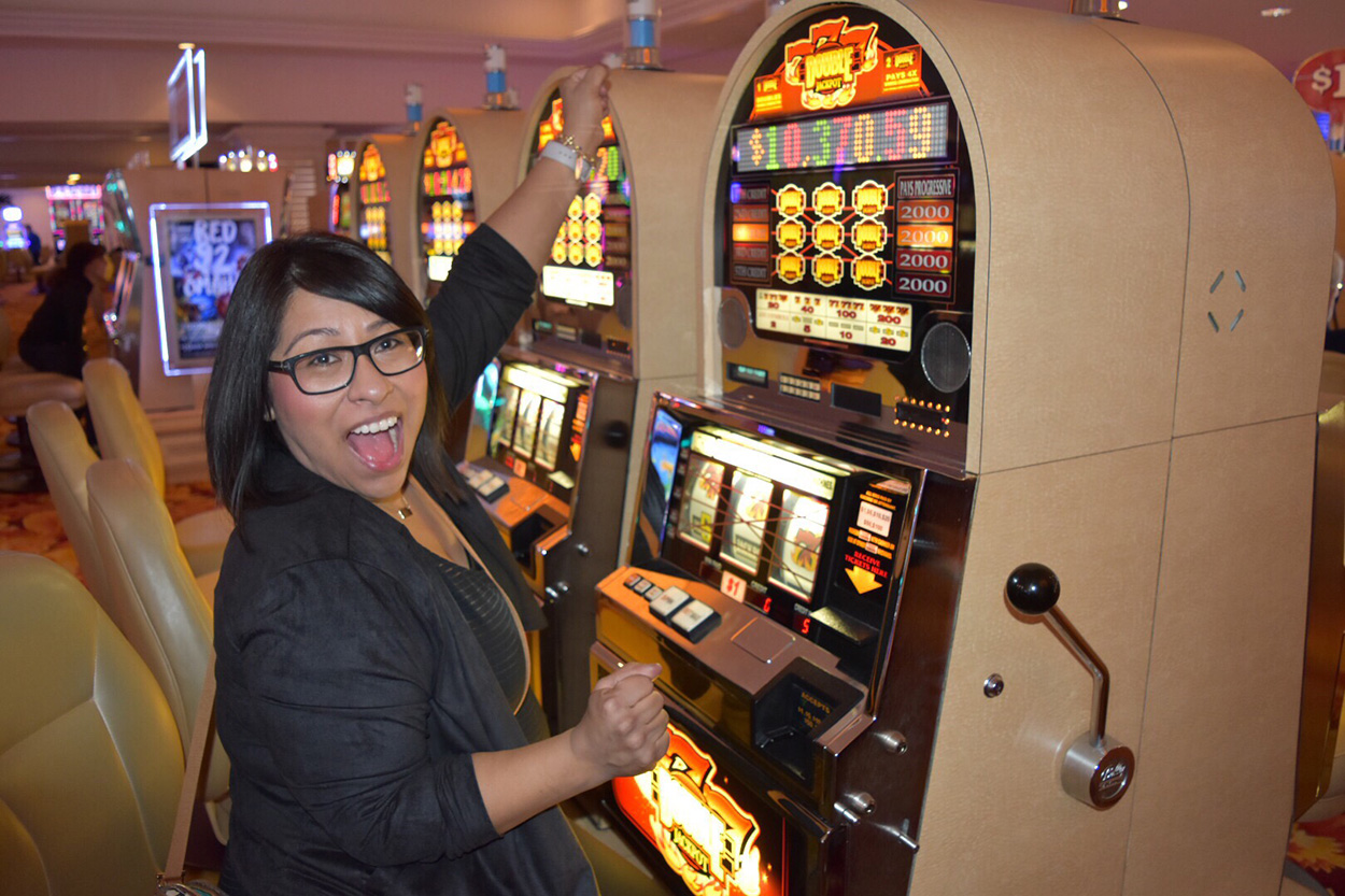 Woman Sitting at a Las Vegas Slot Machine.