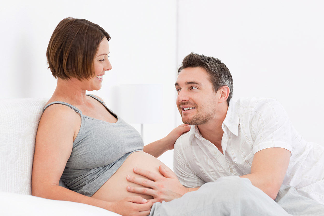 Happy pregnant woman with husband