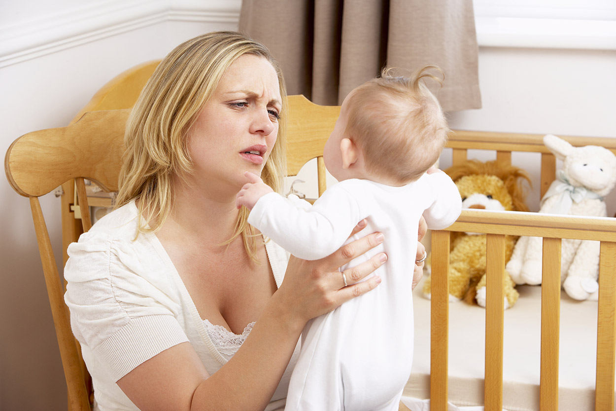 Woman looking at baby stressed